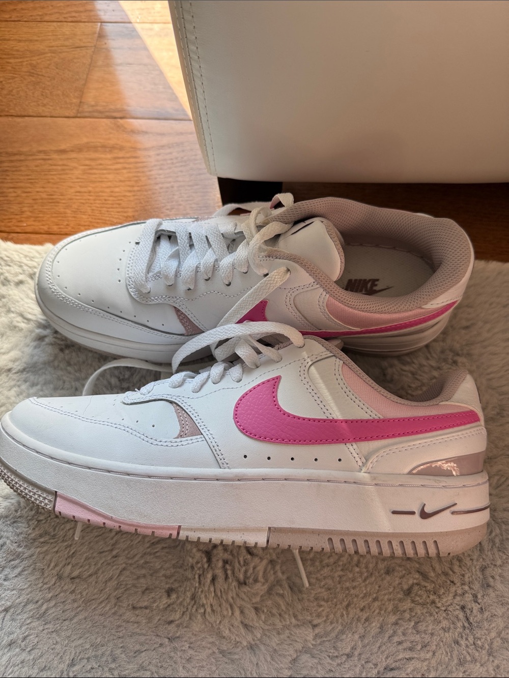 Nike Women's White Sneakers with Pink Swoosh